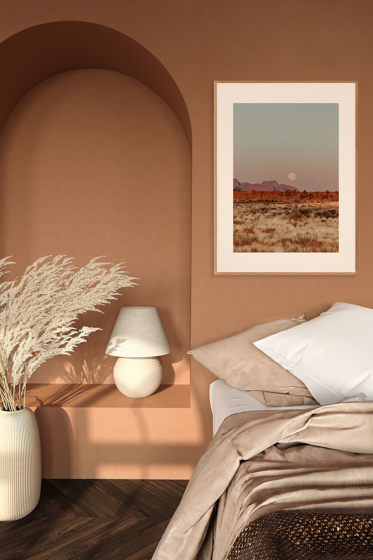 Interior mockup featuring the Kata Tjuta Moonset fine art print by Nikita Pere. The artwork hangs in a warm-toned bedroom with earthy textures, pampas grass, and soft morning light, creating a serene and grounded atmosphere.